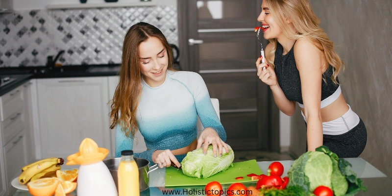 Female athletes preparing fresh vegetables showing the benefits of plant based diet for athletes