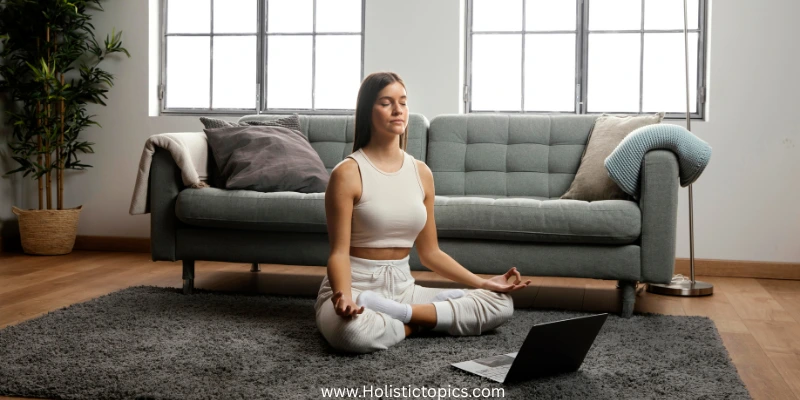 woman meditating in a peaceful meditation space at home sitting on a mat with eyes closed.