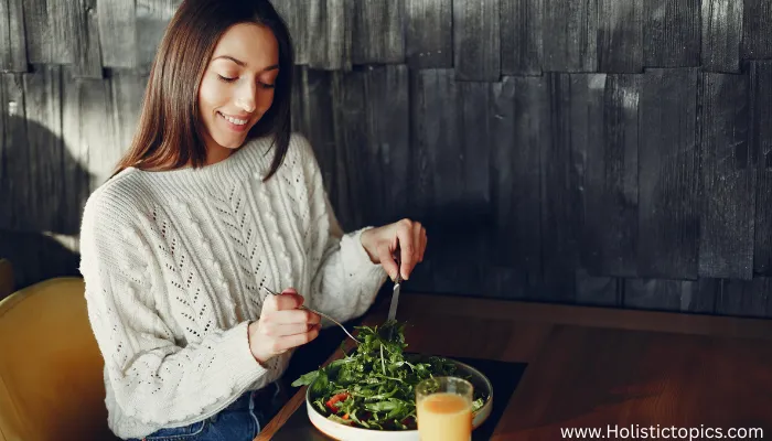 woman eating fresh plant foods showing the benefits of plant based diet on skin