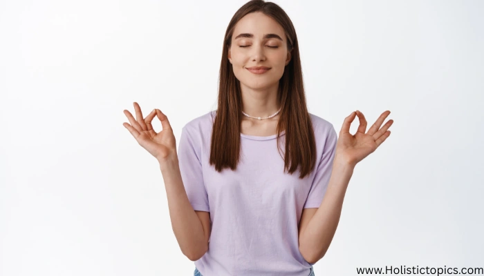 Woman practicing box breathing technique with calm expression, showing relaxation and stress relief benefits.
